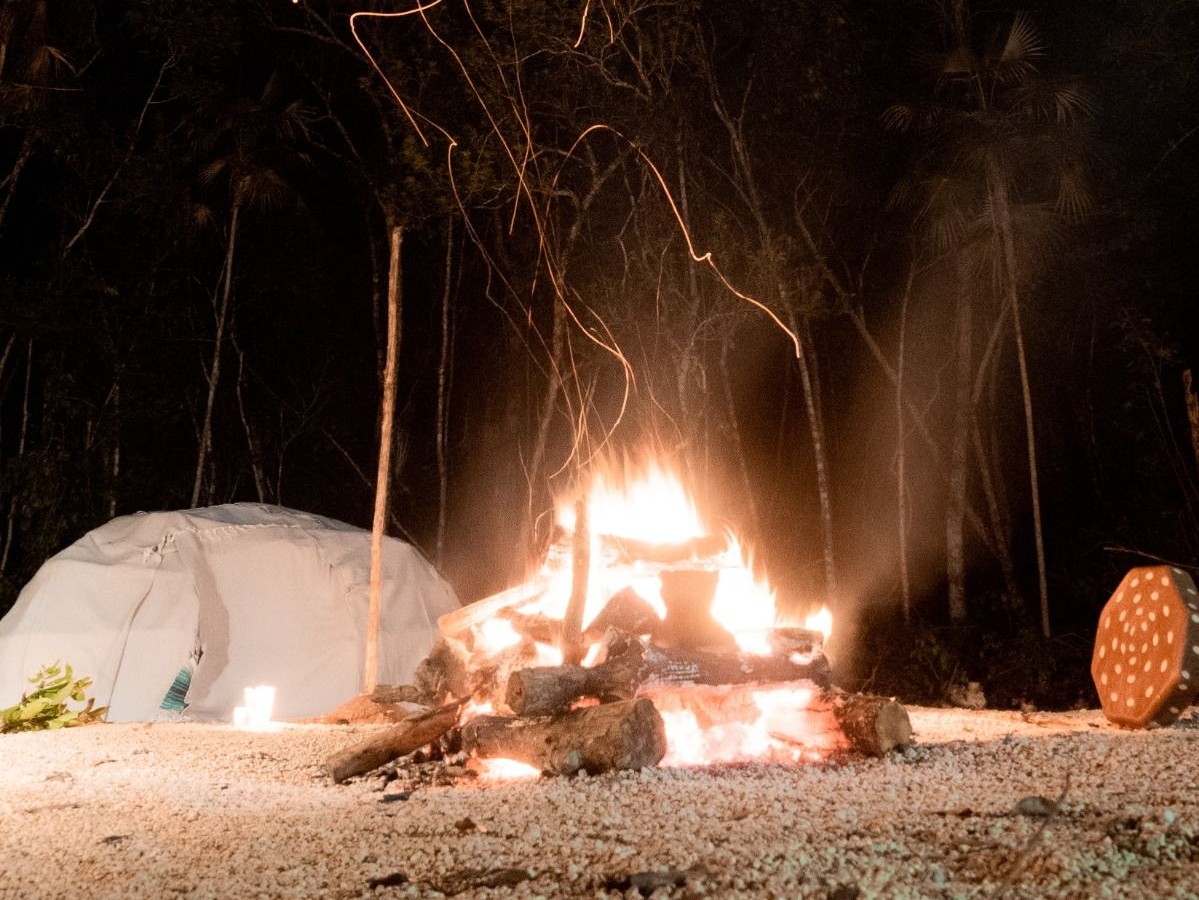 Temazcal sweat lodge at night with fire at Casa Arkaana