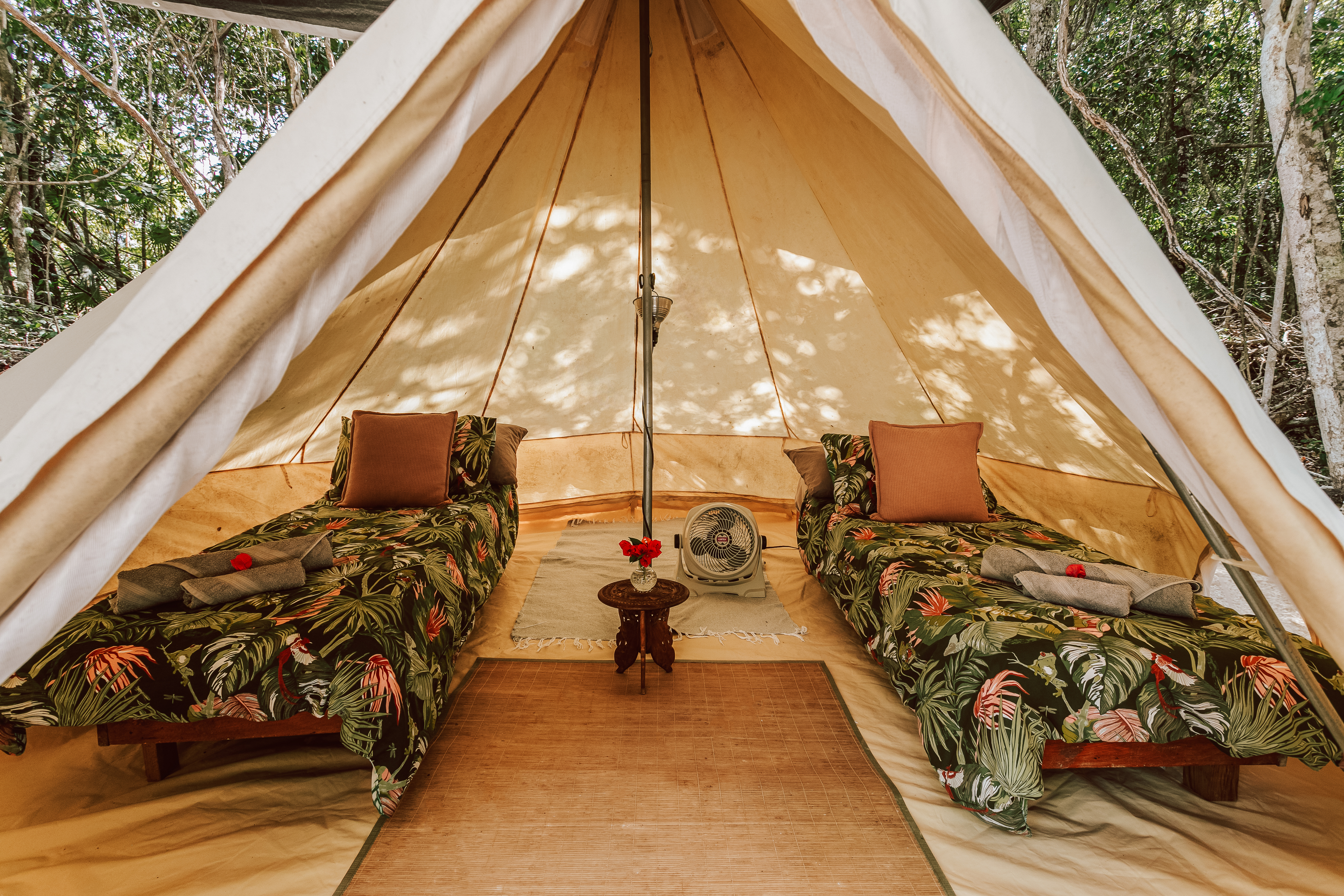 Canvas glamping tent in jungle clearing at Casa Arkaana